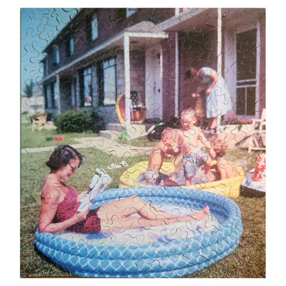 1011-01 Woman Relaxing in an Inflatable Pool, 1956